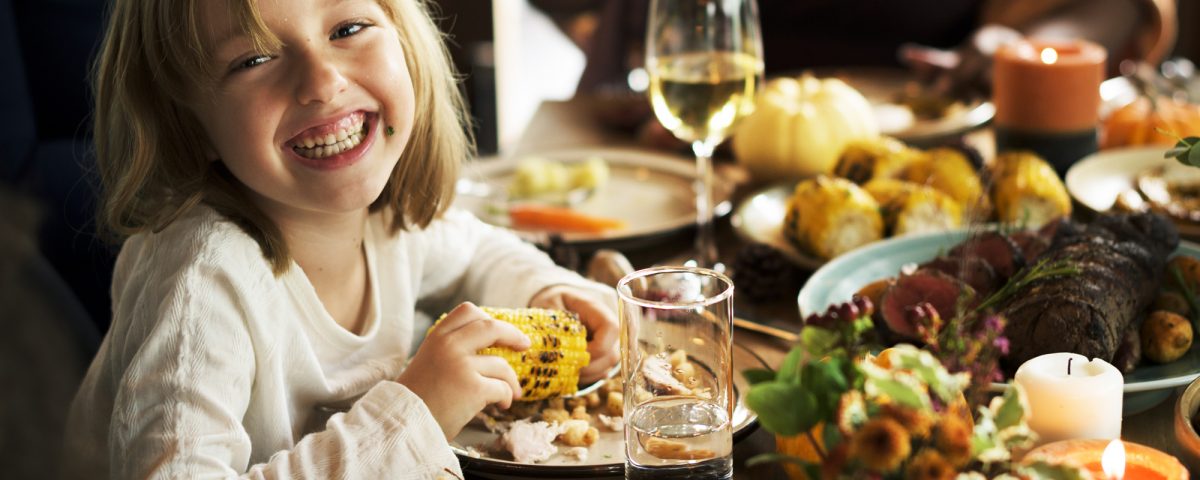 make a decision and commit to something young girl eating thanksgiving dinner at a family table